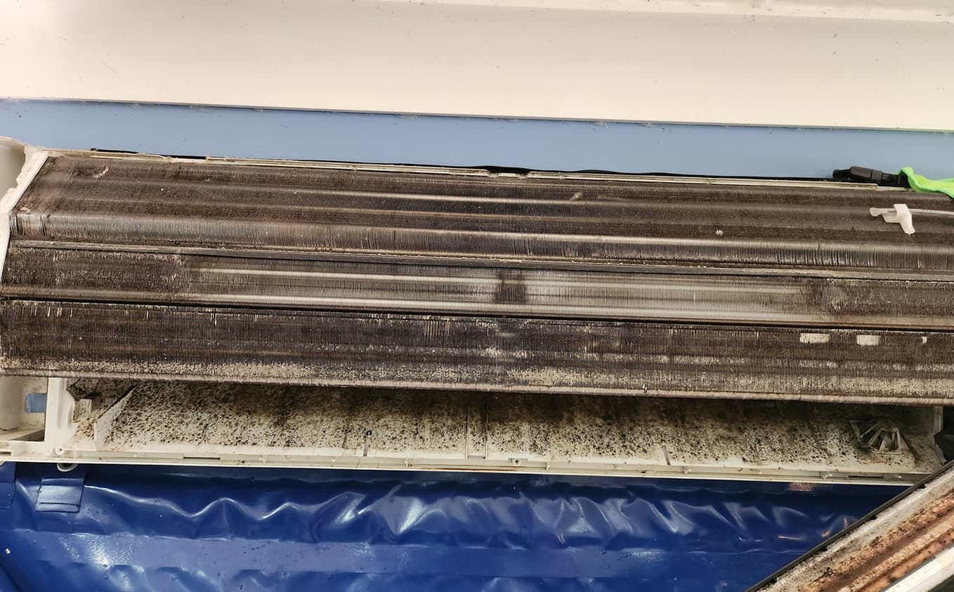 Split system air conditioner with visible mould buildup before cleaning in Sunshine Coast